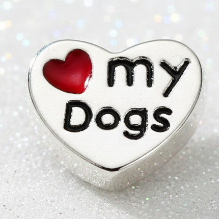 A heart-shaped silver charm with a red heart icon and the words 'my Dogs' in black lettering, shown on a plain white background.