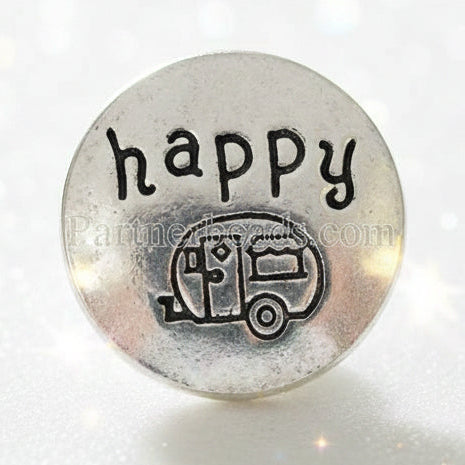 A round silver-toned metal snap button featuring the word 'happy' in raised lettering above an engraved camper trailer design, shown on a plain white background.