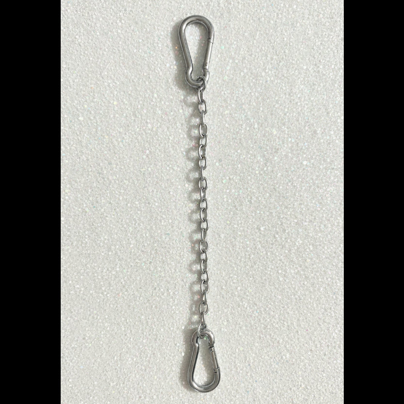 A silver metal chain link connector with two carabiner hooks, shown vertically against a plain off-white background.