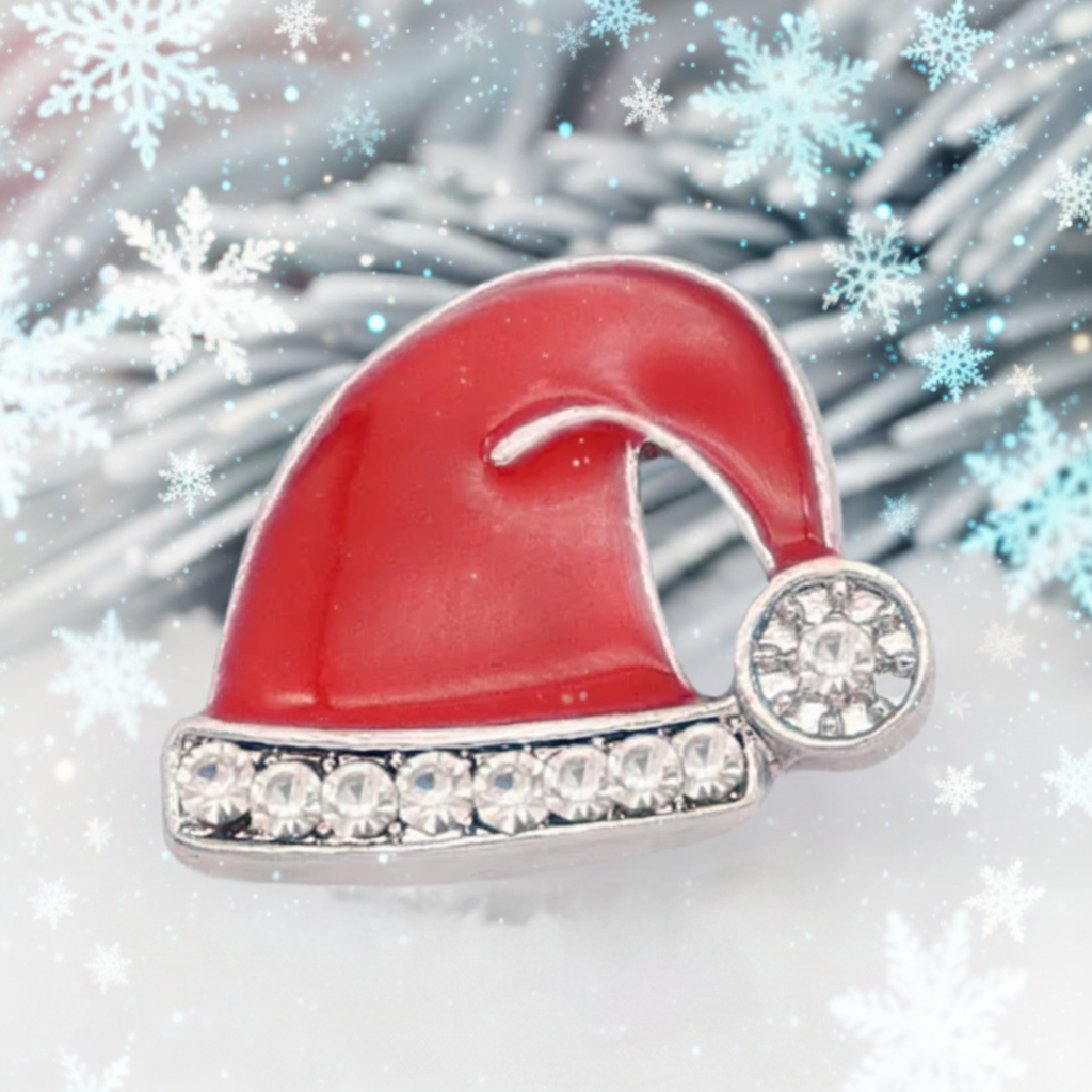A red and silver Santa hat snap with clear rhinestones, shown close-up against a blurred festive background.
