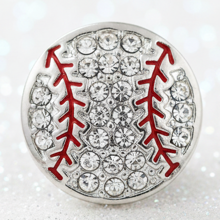 A round silver-toned snap button designed like a baseball, featuring clear rhinestones and red stitched seam details, isolated on a white background.